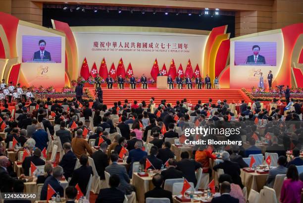 John Lee, Hong Kong's chief executive, center, speaks during a reception to celebrate National Day in Hong Kong, China, on Saturday, Oct. 1, 2022....