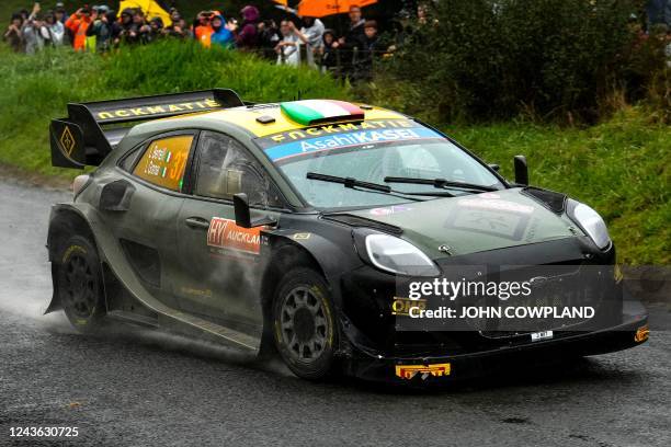 Italy's Lorenzo Bertelli and co-driver Simone Scattolin drive their Ford Puma Rally 1 Hybrid during SS12 of the Rally New Zealand, the 11th round of...