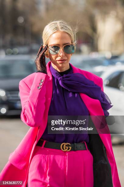Digital influencer and TV presenter Katerina Evangelinou wears a Zara suit and shirt, Gucci belt and sunglasses and black lace gloves on February 29,...