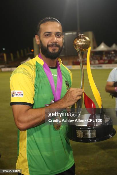 Imad Wasim of Jamaica Tallawahs poses with the CPL T20 trophy after winning the Men's 2022 Hero Caribbean Premier League Final between Barbados...