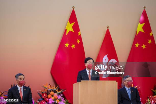 John Lee, Hong Kong's chief executive, center, speaks during a reception to celebrate National Day in Hong Kong, China, on Saturday, Oct. 1, 2022....