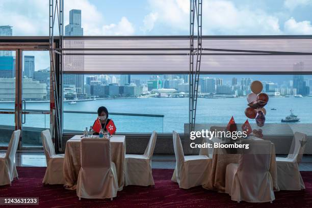 The flags of China and Hong Kong Special Administrative Region on tables during a reception to celebrate National Day in Hong Kong, China, on...