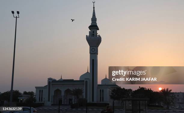 Picture shows a mosque at sunset in the Qatari capital Doha on September 30, 2022.