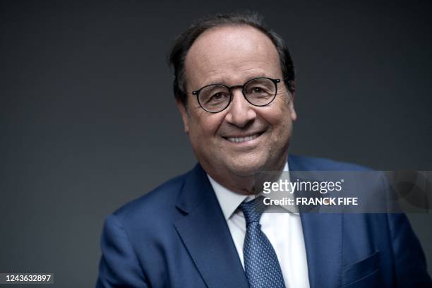 Former French President Francois Hollande poses for a photo session on the occasion of an event dubbed "Demain le sport" , in Paris on September 22,...