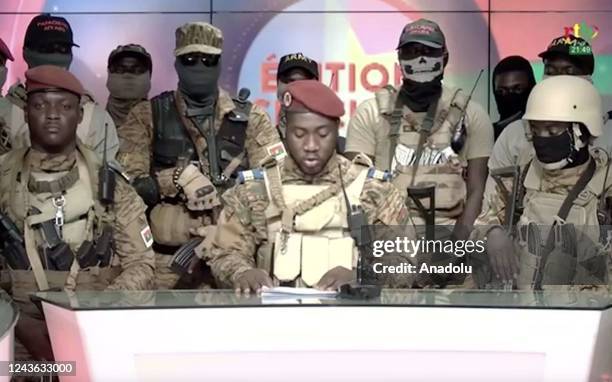 Screen grab shows from state TV, army Capt. Kiswendsida Farouk Azaria Sorgho reads a statement in Ougadougou, Burkina Faso, on Sept. 30, 2022....