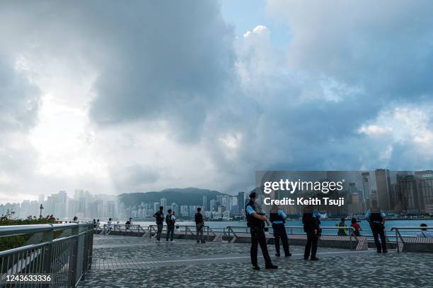 Police officers stand guard during China's National Day on October 1, 2022 in Hong Kong, China. China celebrates its National Day on October 1st...