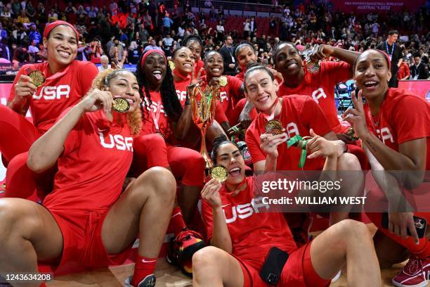 Team USA celebrate with their Gold medals of a trophy after the 2022 FIBA Women's Basketball World Cup final match between China and the USA at the...