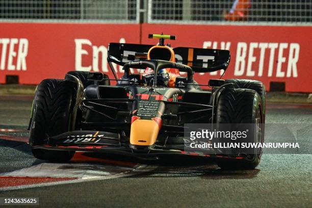 Red Bull Racing's Mexican driver Sergio Perez drives during a practice session ahead of the Formula One Singapore Grand Prix night race at the Marina...