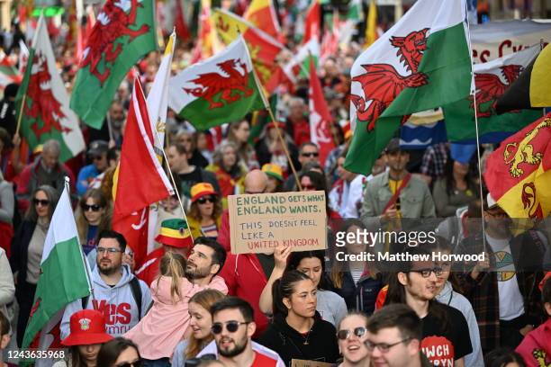 Protestors walk through Queen Street during a march in support of Welsh Independence on October 1, 2022 in Cardiff, Wales. A recent YouGov poll...