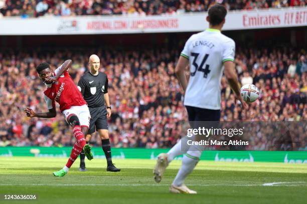 Thomas Partey of Arsenal scores the opening goal during the Premier League match between Arsenal FC and Tottenham Hotspur at Emirates Stadium on...