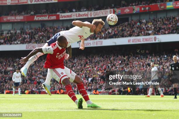 Harry Kane of Tottenham climbs above Arsenal defender Gabriel to head the ball during the Premier League match between Arsenal FC and Tottenham...