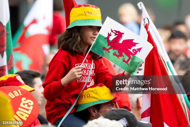 Girl holds a Wales flag during a march in support of Welsh Independence on October 1, 2022 in Cardiff, Wales. A recent YouGov poll suggested support...
