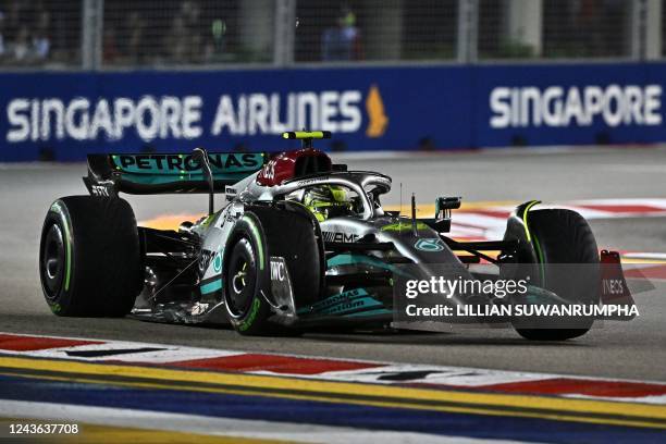 Mercedes' British driver Lewis Hamilton drives during the qualifying session ahead of the Formula One Singapore Grand Prix night race at the Marina...