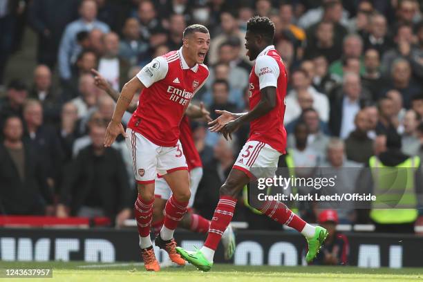 Granit Xhaka of Arsenal and Thomas Partey of Arsenal celebrate the opening goal during the Premier League match between Arsenal FC and Tottenham...