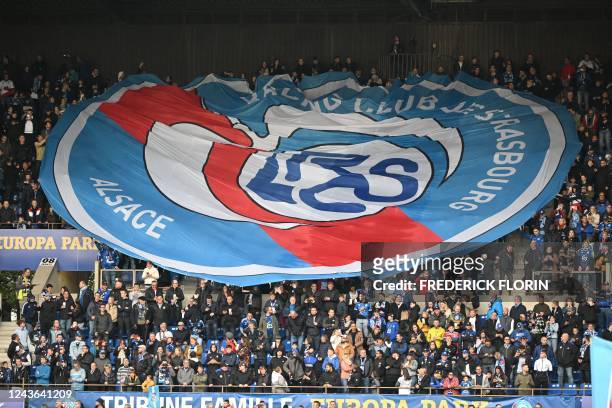 Strasbourgs supporters hold a giant logo ahead of the French L1 football match between RC Strasbourg Alsace and Stade Rennais FC at Stade de la...