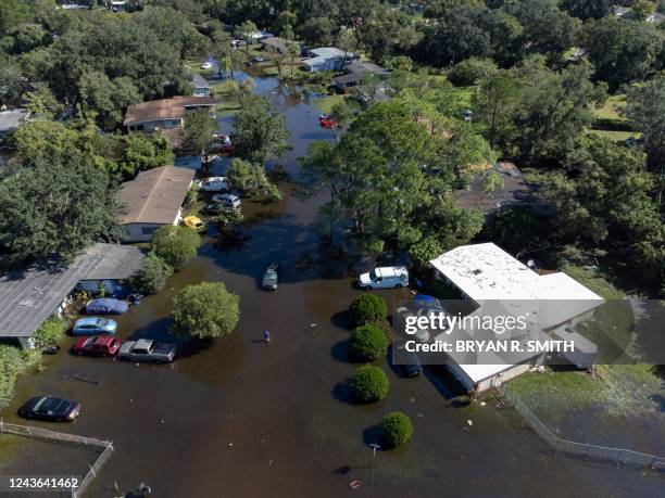 This aerial taken on October 1, 2022 shows a flooded neighborhood following Hurricane Ian on October 1, 2022 in Orlando, Florida. - Deadly Hurricane...