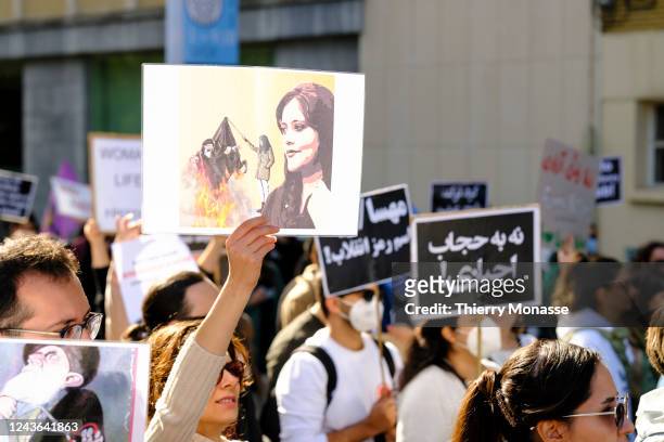People participate in a demonstration against the death of Iranian Mahsa Amini on October 1, 2022 in Brussels, Belgium. 22-year-old Mahsa Amini fell...