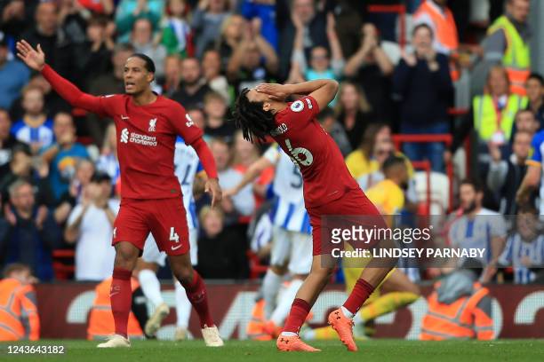 Liverpool's English defender Trent Alexander-Arnold reacts after missing a late freekick during the English Premier League football match between...