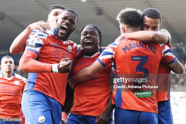 Michael Obafemi of Swansea City celebrates his goal with team mates Olivier Ntcham Ryan Manning and Joel Latibeaudiere during the Sky Bet...