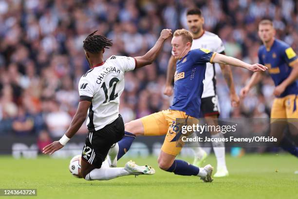 Nathaniel Chalobah of Fulham fouls Sean Longstaff of Newcastle United while leads to a red card during the Premier League match between Fulham FC and...