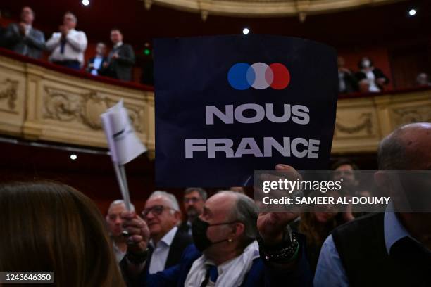 Supporter holds a banner of the new movement "Nous France" launched by Les Republicains party's member and head of the Hauts-de-France regional...