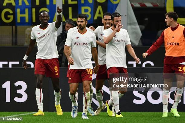 Roma's British defender Chris Smalling celebrates after scoring during the Italian Serie A football match between Inter and AS Roma on October 1,...