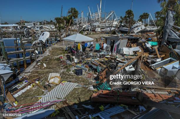 Debris is seen in Fort Myers, Florida, in the aftermath of Hurricane Ian on October 1, 2022. - Shocked Florida communities counted their dead...