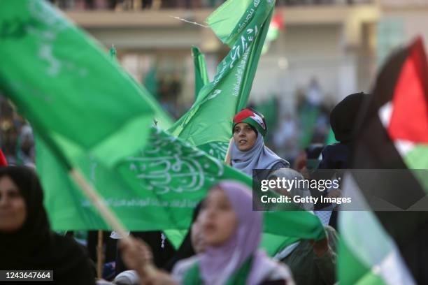Supporters of the Palestinian Hamas movement wave national flags during a rally in solidarity with al-Aqsa mosque on October 1, 2022 in Gaza City,...