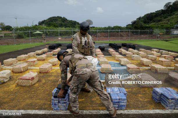 Members of the National Aeronaval Service display seized drug bags at a military base in Panama City, on October 1, 2022. - Panama seized more than 3...