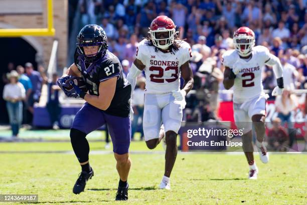 Wide receiver Gunnar Henderson of the TCU Horned Frogs rushes up the field after catching a pass in the first half of TCU's home game against...