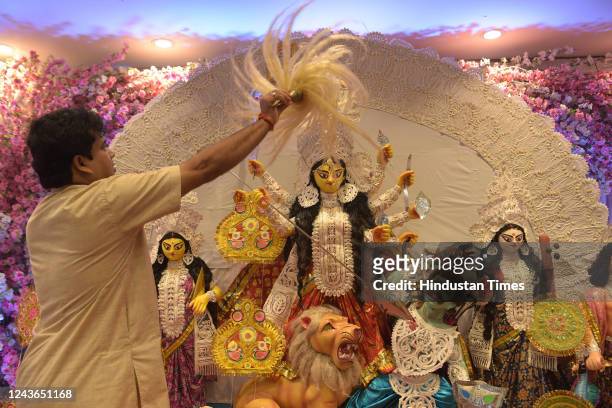 Devotees worship Goddess Durga during Durga Puja celebrations at Amra Sobai Probasi Seva Mondal Durgotsav Sharod Utsav, at Kopar Khairane, on October...