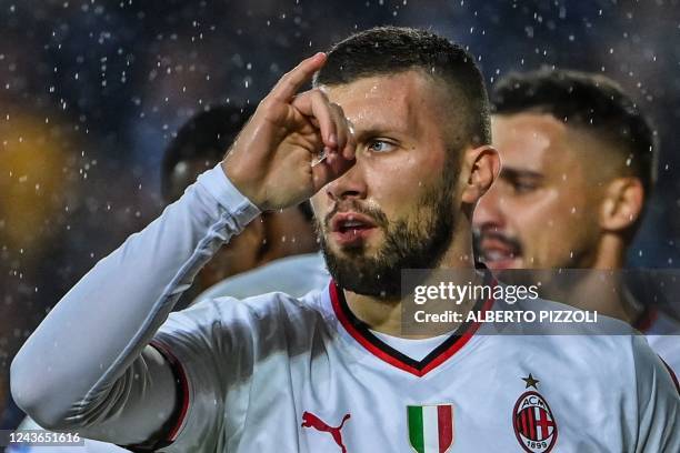 Milan's Croatian forward Ante Rebic celebrates after opening the scoring during the Italian Serie A football math between Empoli and AC Milan on...