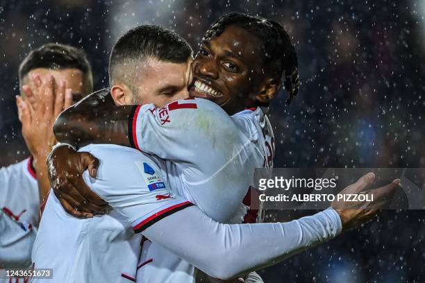 Milan's Croatian forward Ante Rebic celebrates with AC Milan's Portuguese forward Rafael Leao after opening the scoring during the Italian Serie A...