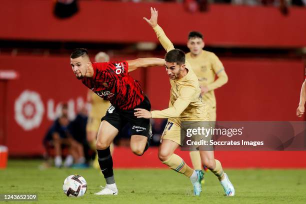 Ferran Torres of FC Barcelona Martin Valjent of Real Mallorca during the La Liga Santander match between Real Mallorca v FC Barcelona at the Visit...