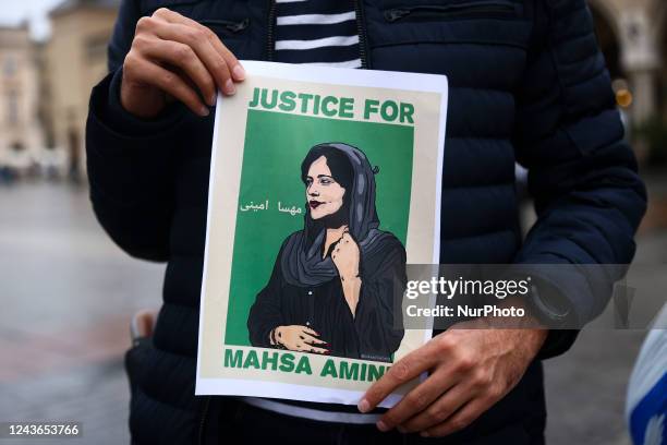 People attend solidarity demonstration in memory of Mahsa Amini, at the Main Square in Krakow, Poland on October 1st, 2022. Protests have erupted...