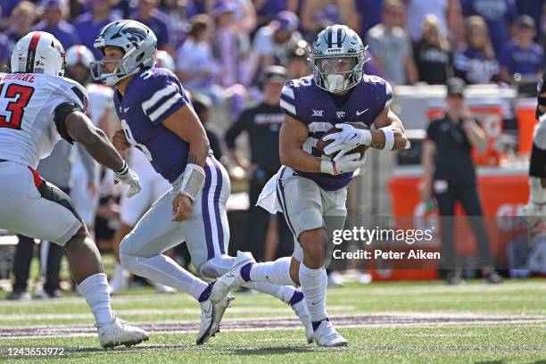 Running back Deuce Vaughn of the Kansas State Wildcats runs with the ball against the Texas Tech Red Raiders during the first half at Bill Snyder...