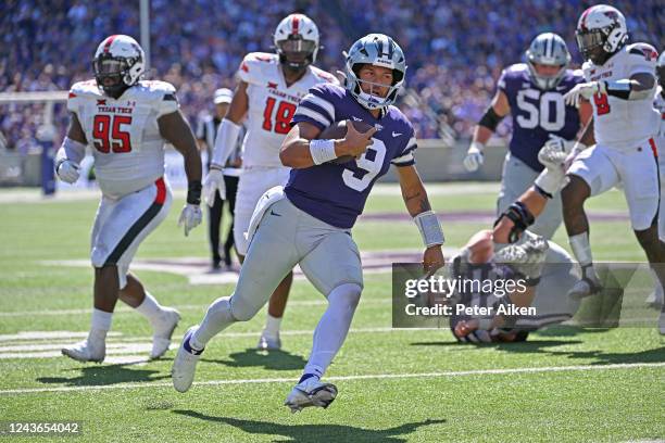 Quarterback Adrian Martinez of the Kansas State Wildcats rushes for a touchdown against the Texas Tech Red Raiders during the second half at Bill...