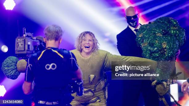 October 2022, North Rhine-Westphalia, Cologne: Katja Burkard, presenter, is on stage as the character "Der Brokkoli" in the Prosieben show "The...