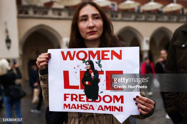 Woman holds a banner during solidarity demonstration in memory of Mahsa Amini, at the Main Square in Krakow, Poland on October 1st, 2022. Protests...