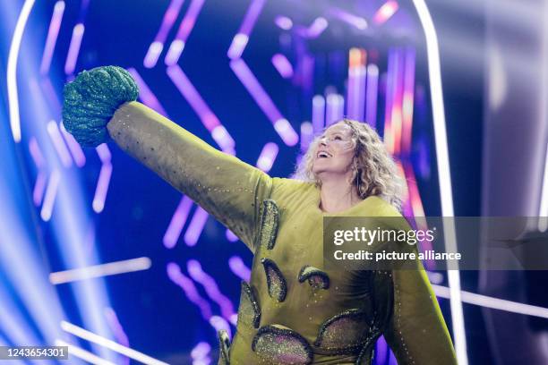 October 2022, North Rhine-Westphalia, Cologne: Katja Burkard, presenter, is on stage as the character "Der Brokkoli" in the Prosieben show "The...