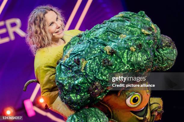 October 2022, North Rhine-Westphalia, Cologne: Katja Burkard, presenter, is on stage as the character "Der Brokkoli" in the Prosieben show "The...
