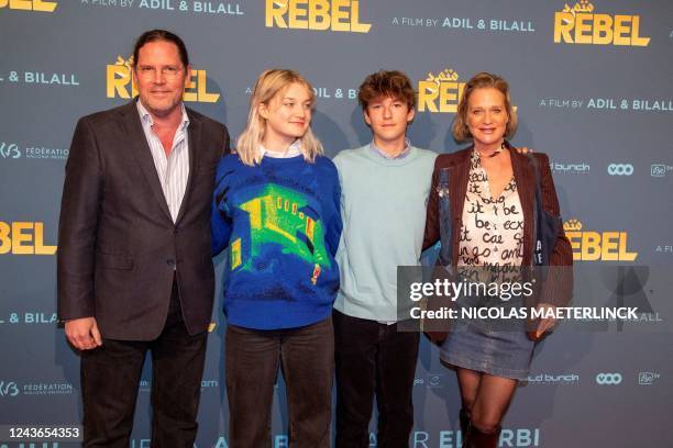 Princess Delphine of Belgium , her husband Jim O'Hare , and their children Josephine O'Hare and Oscar O'Hare pose at the premiere of the film...