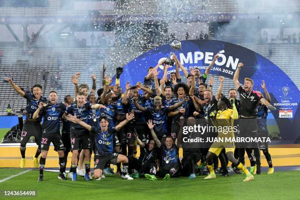 Independiente del Valle players celebrate with the trophy of the Copa Sudamericana football tournament after the final match between Sao Paulo and...