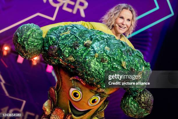 October 2022, North Rhine-Westphalia, Cologne: Katja Burkard, presenter, is on stage as the character "Der Brokkoli" in the Prosieben show "The...