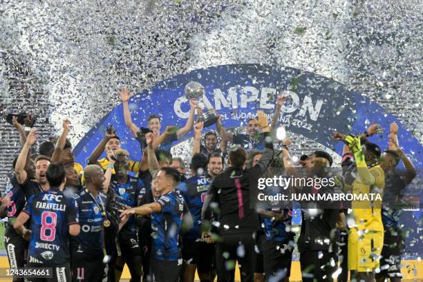 Independiente del Valle players celebrate with the trophy of the Copa Sudamericana football tournament after the final match between Sao Paulo and...