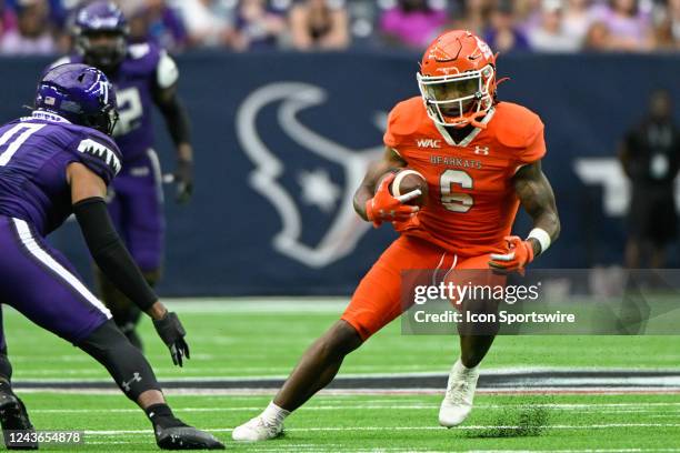 Sam Houston State Bearkats wide receiver Noah Smith cuts back between two defenders at the end of a second half pass reception during the football...