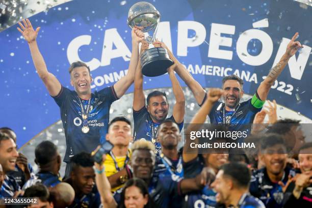 Independiente del Valle players celebrate with the trophy of the Copa Sudamericana football tournament after the final match between Sao Paulo and...