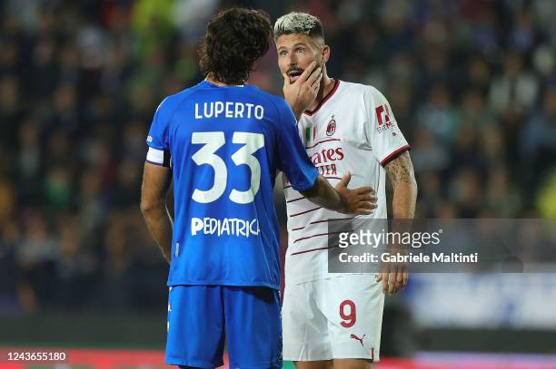 Sebastiano Luperto of Empoli FC and Olivier Jonatha Giroud of AC Milan during the Serie A match between Empoli FC and AC MIlan at Stadio Carlo...