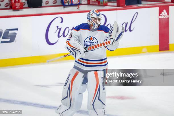 Goaltender Calvin Pickard of the Edmonton Oilers takes part in the pre-game warm up prior to NHL pre-season action against the Winnipeg Jets at the...