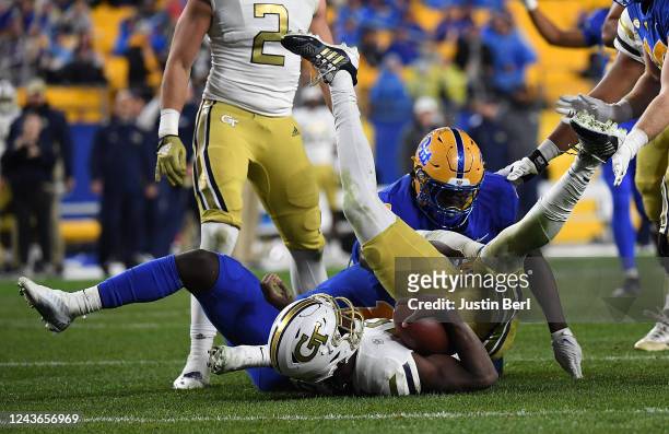 Jeff Sims of the Georgia Tech Yellow Jackets is sacked by Bangally Kamara of the Pittsburgh Panthers in the second quarter of the game at Acrisure...